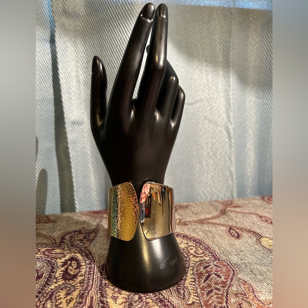 Gold and silver toned statement bracelet.